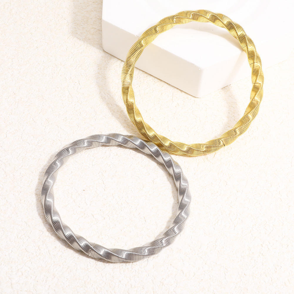 Luxury Twisted Ribbed Bangle – Gold & Silver Finish