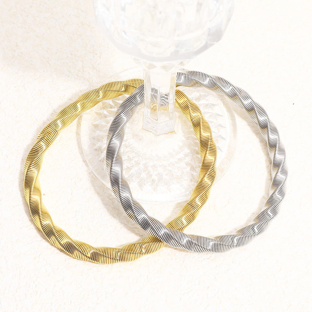 Luxury Twisted Ribbed Bangle – Gold & Silver Finish